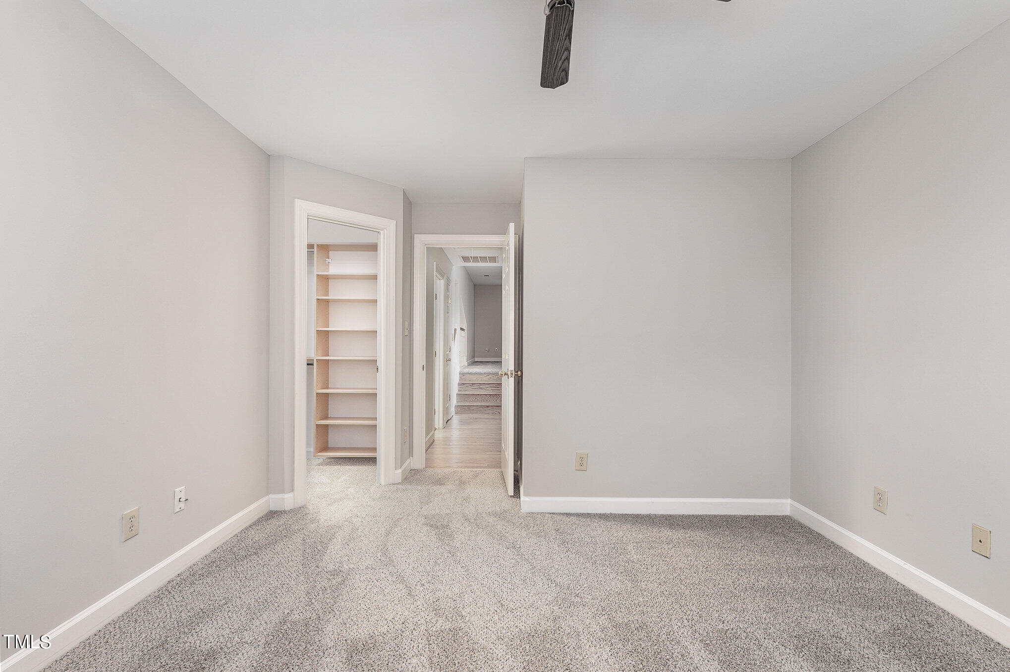 305 Fairwinds Drive Cary, NC 27518 - Photo 15 of 27 an empty room with closet and windows
