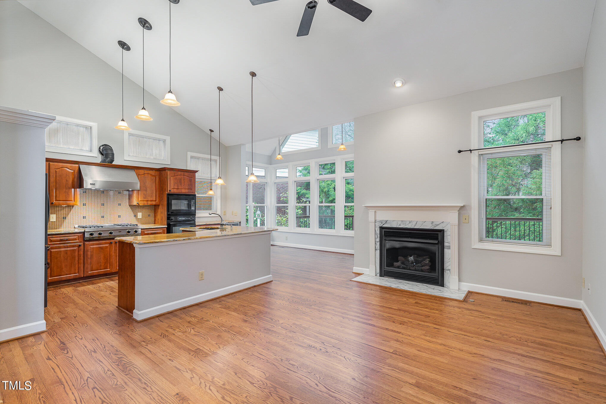 305 Fairwinds Drive Cary, NC 27518 - Photo 2 of 27 a open kitchen with granite countertop a stove top oven a sink a counter space and stainless steel appliances