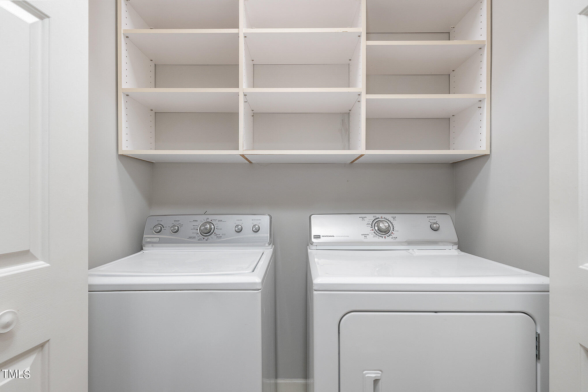 305 Fairwinds Drive Cary, NC 27518 - Photo 18 of 27 a utility room with dryer and washer