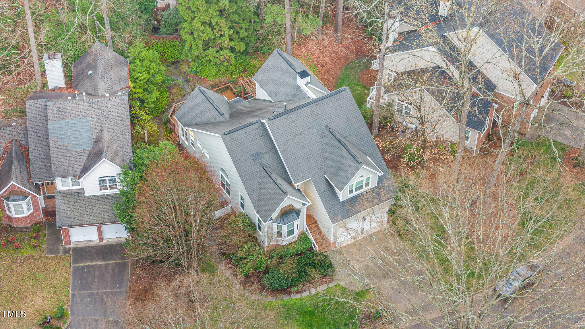 305 Fairwinds Drive Cary, NC 27518 - Photo 23 of 27 an aerial view of a house with a yard and trees