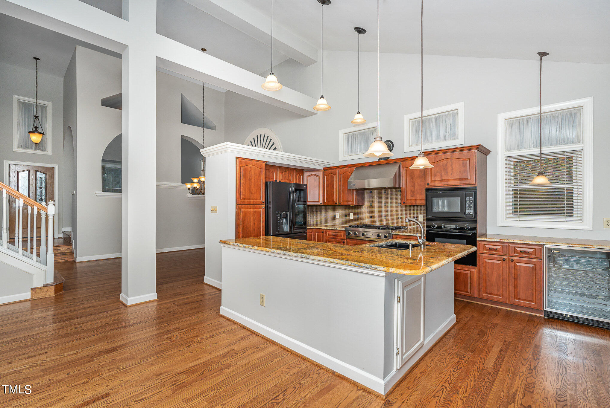 305 Fairwinds Drive Cary, NC 27518 - Photo 25 of 27 a kitchen with stainless steel appliances granite countertop a stove and a refrigerator