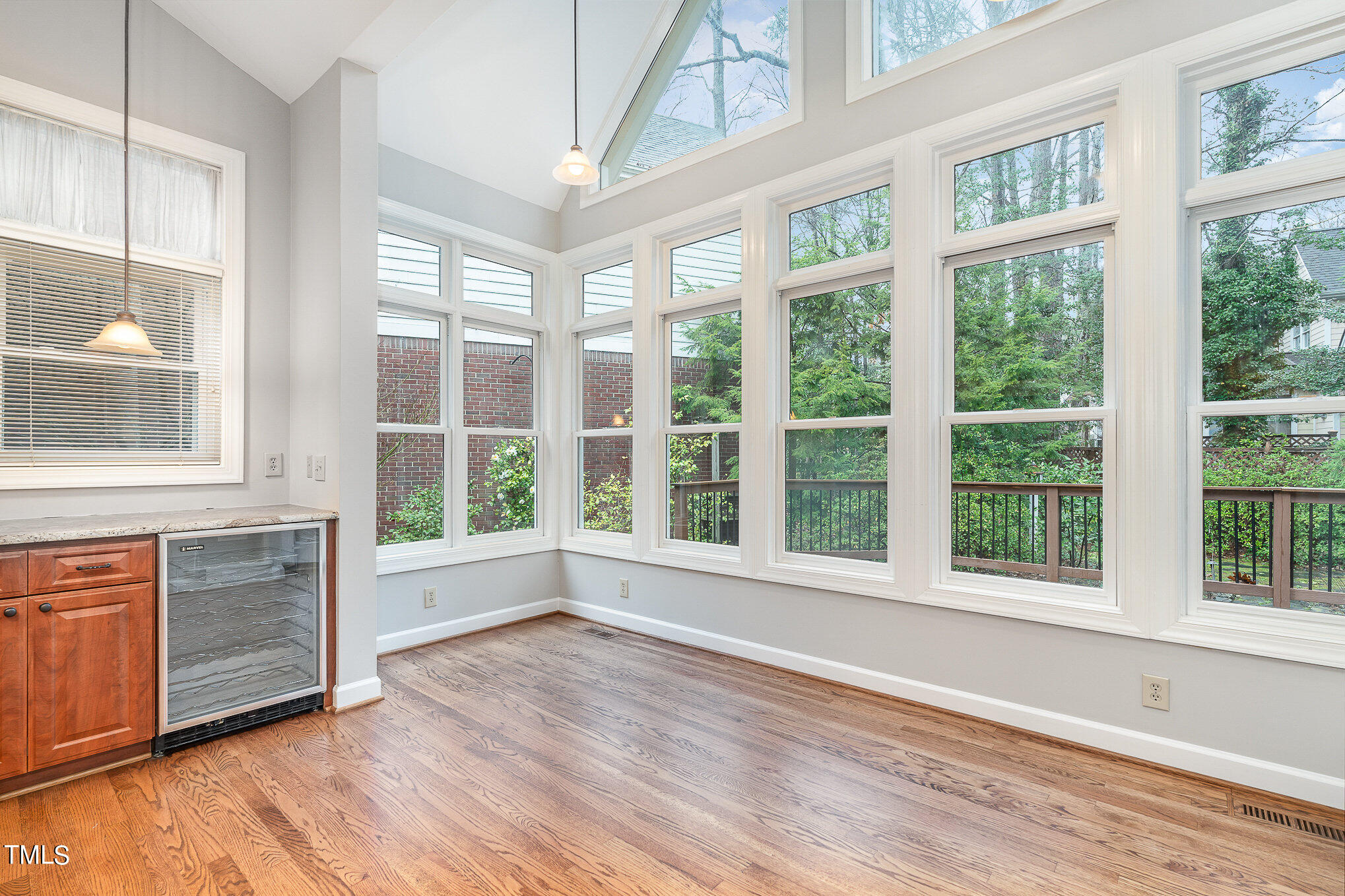 305 Fairwinds Drive Cary, NC 27518 - Photo 5 of 27 an empty room with wooden floor and windows