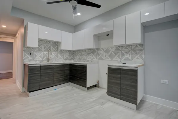 a kitchen with a stove and a sink