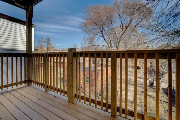 a view of wooden balcony with a swing