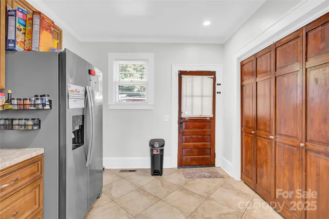 a view of a livingroom with an empty space and a window