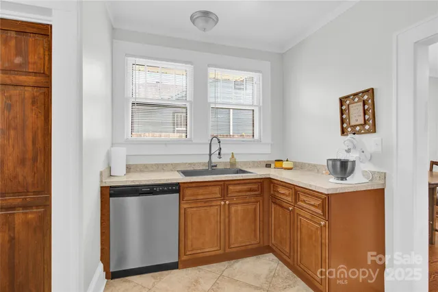 a view of a kitchen with sink cabinets and a window