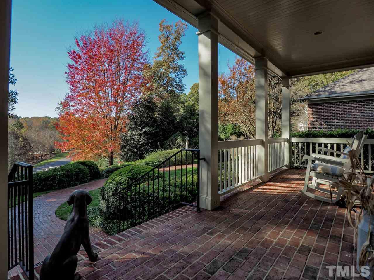 1408 Ridge Side Place Raleigh, NC 27613 - Photo 2 of 25 a view of a porch with a table and chairs