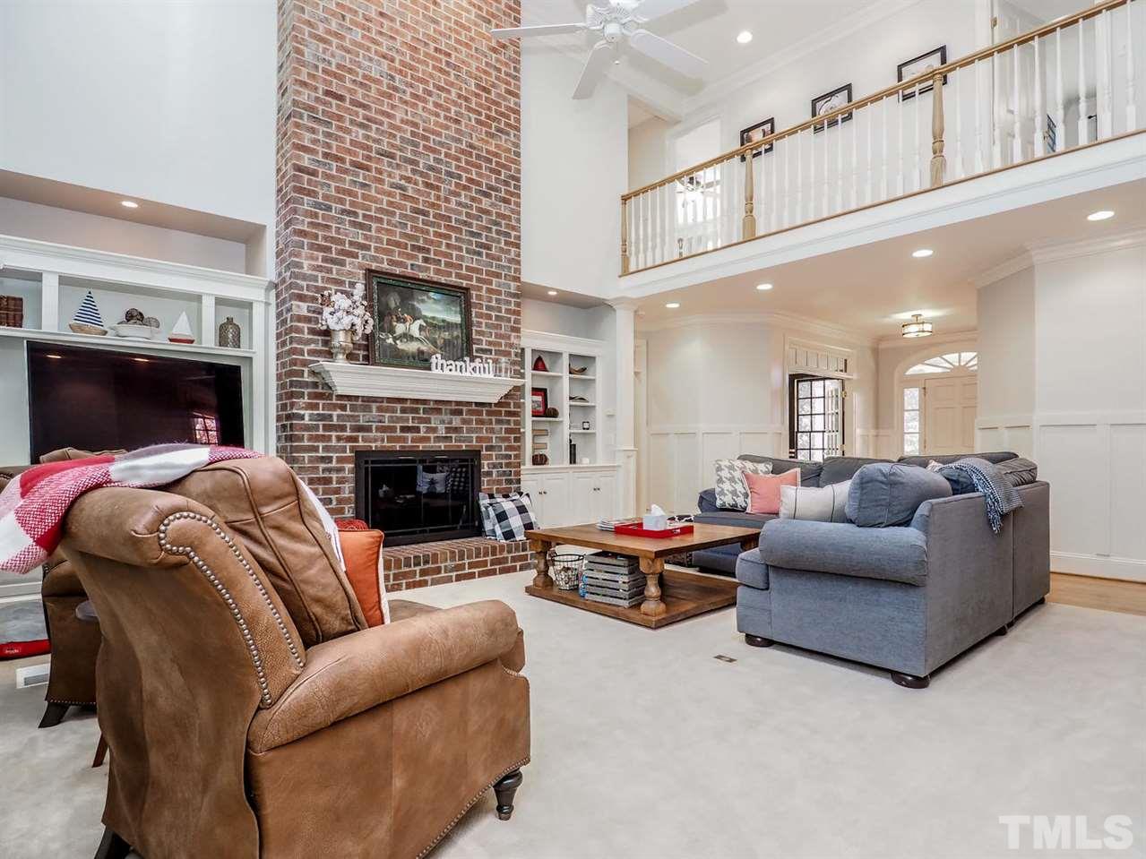 1408 Ridge Side Place Raleigh, NC 27613 - Photo 12 of 25 a living room with furniture and a fireplace