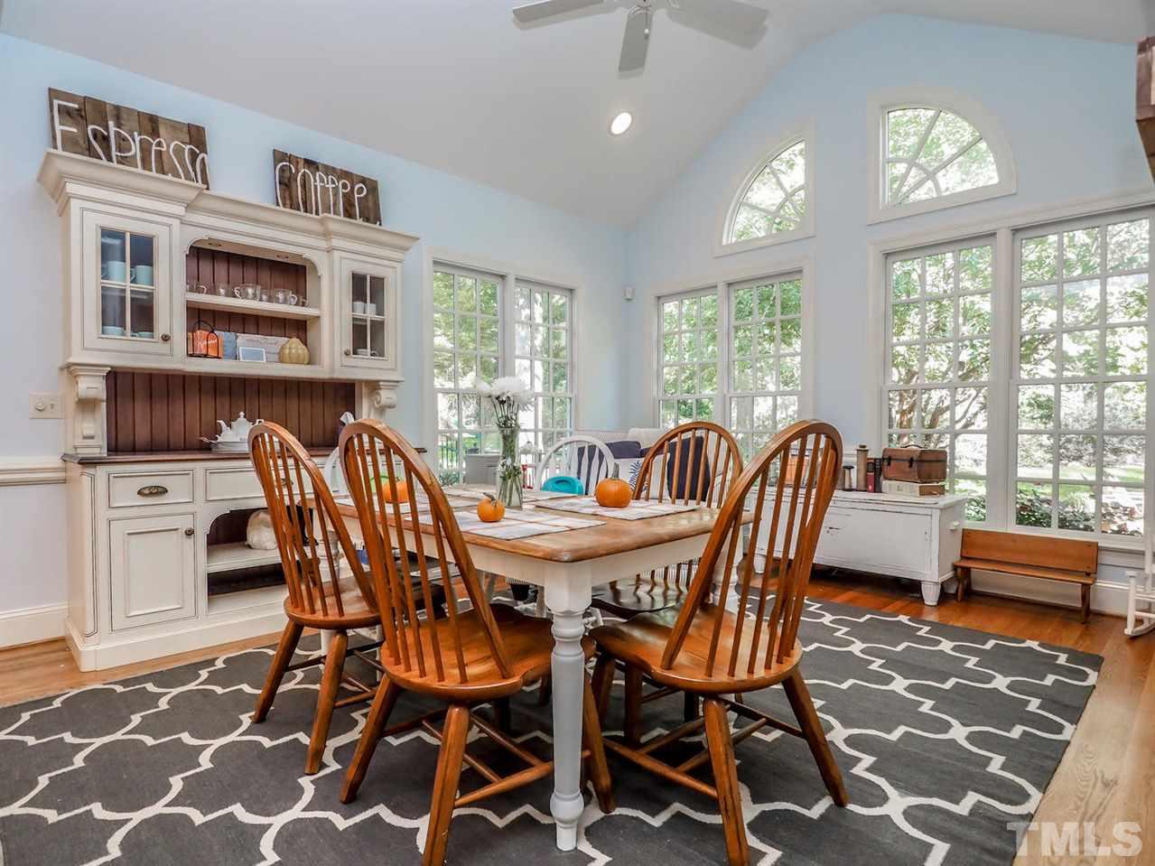 1408 Ridge Side Place Raleigh, NC 27613 - Photo 13 of 25 a view of a dining room with furniture