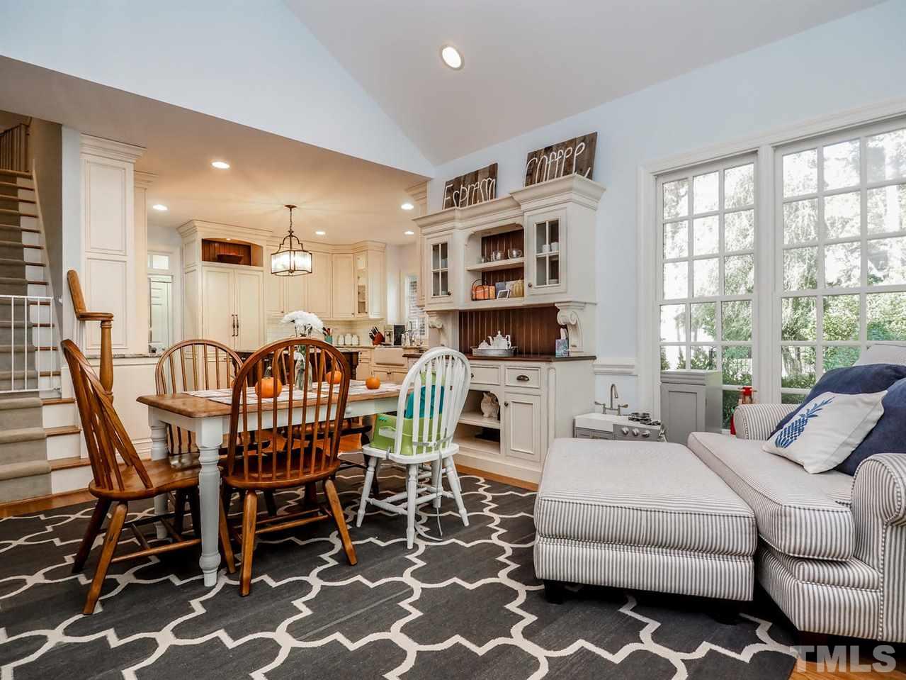 1408 Ridge Side Place Raleigh, NC 27613 - Photo 14 of 25 a living room with furniture a flat screen tv and a window