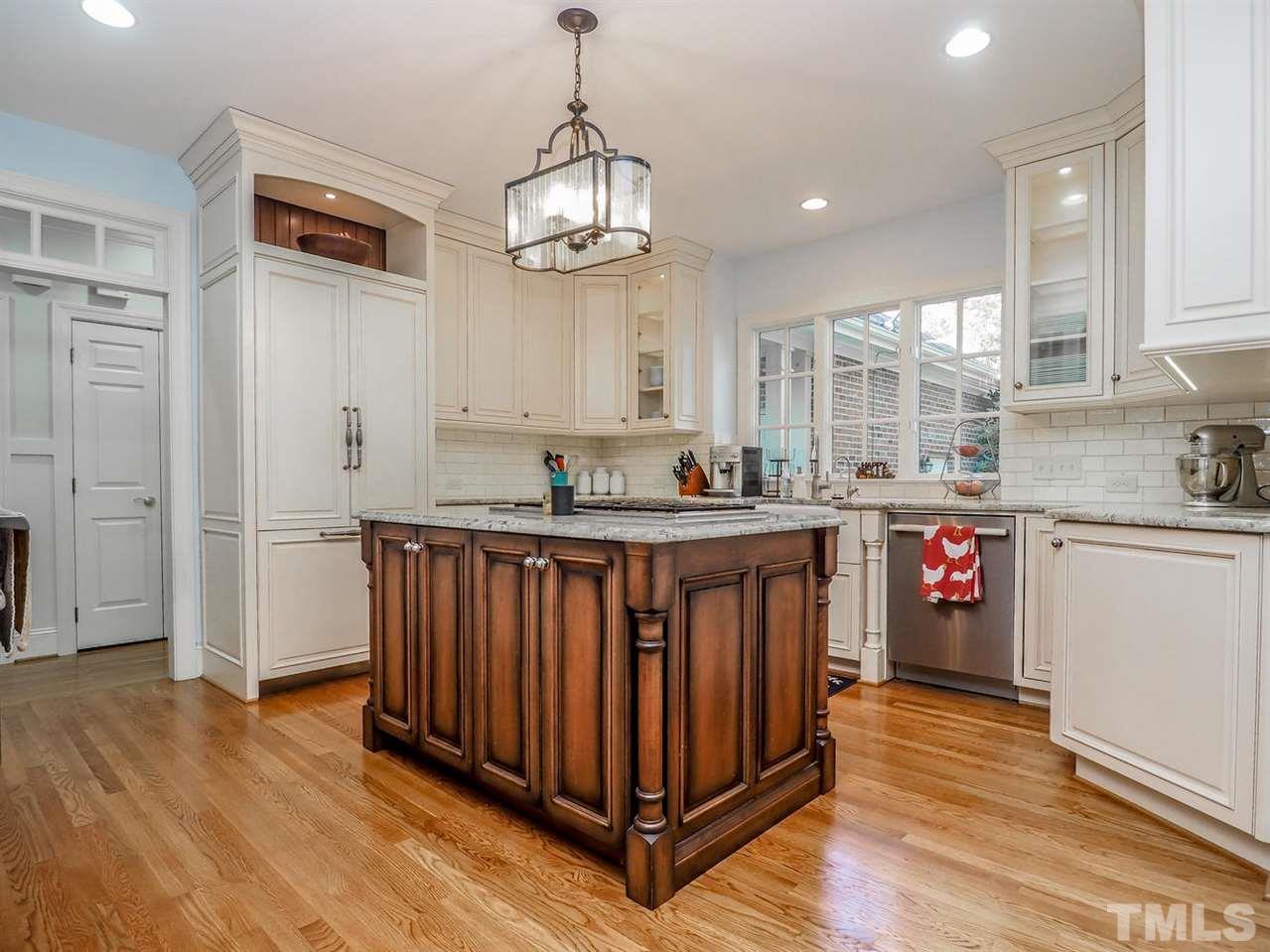 1408 Ridge Side Place Raleigh, NC 27613 - Photo 15 of 25 a open kitchen with stainless steel appliances granite countertop a stove and cabinets