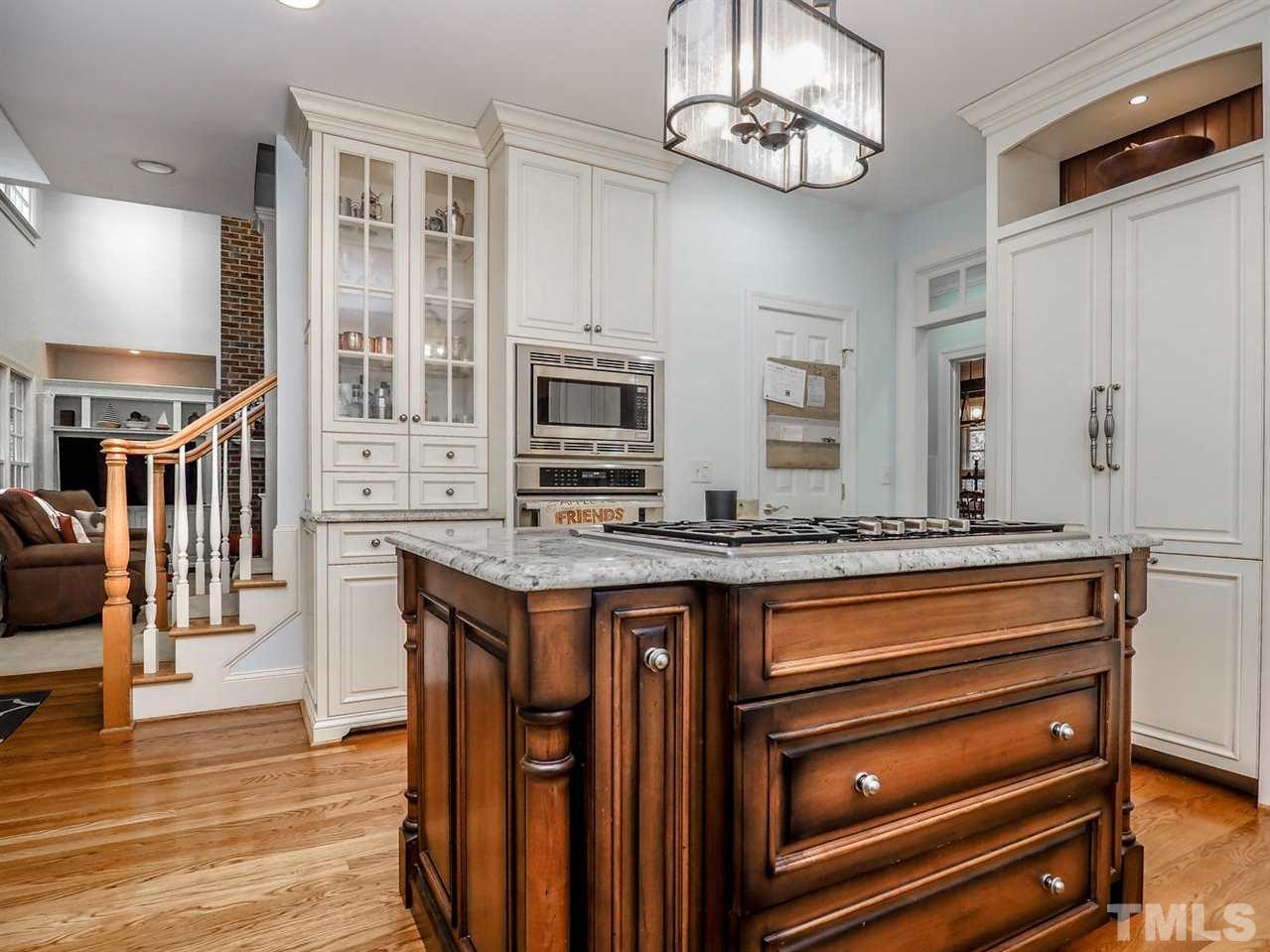 1408 Ridge Side Place Raleigh, NC 27613 - Photo 17 of 25 a kitchen with stainless steel appliances granite countertop a stove and a sink