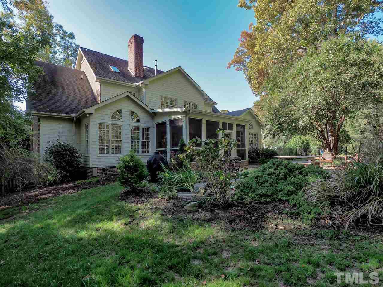 1408 Ridge Side Place Raleigh, NC 27613 - Photo 24 of 25 a front view of a house with a yard