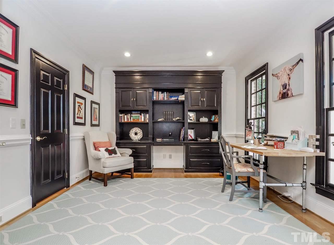1408 Ridge Side Place Raleigh, NC 27613 - Photo 5 of 25 a living room with furniture a piano and a bookshelf