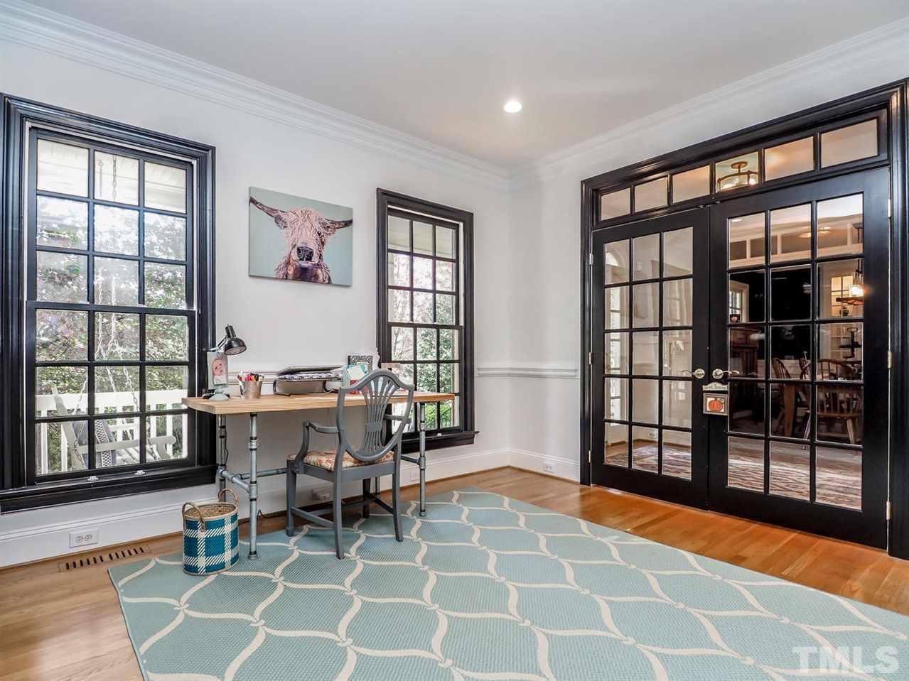 1408 Ridge Side Place Raleigh, NC 27613 - Photo 6 of 25 a dining room with a table and chairs
