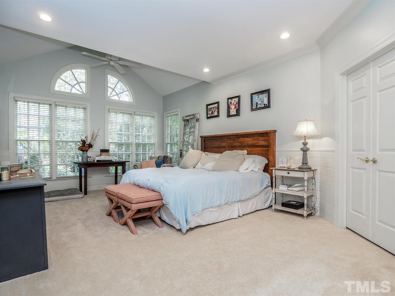 1408 Ridge Side Place Raleigh, NC 27613 - Photo 7 of 25 a bedroom with a bed and a large window