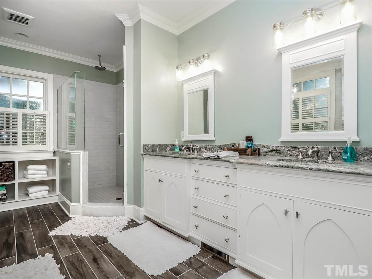 1408 Ridge Side Place Raleigh, NC 27613 - Photo 8 of 25 a bathroom with a sink and a mirror