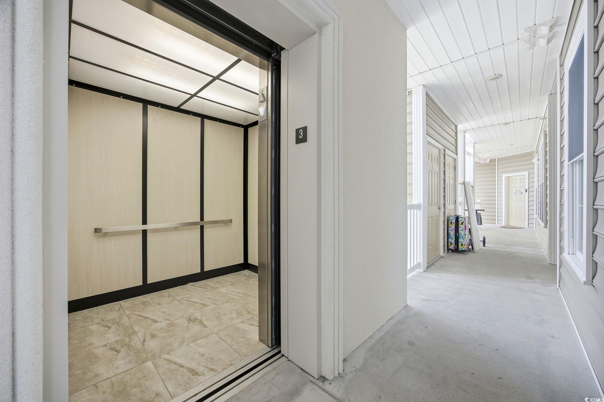 165 Ella Kinley Circle, Unit 302 Myrtle Beach, SC 29588 - Photo 21 of 38 Corridor with elevator