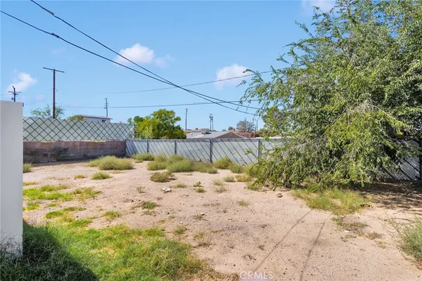 a view of a backyard of the house