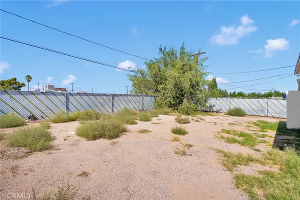 a view of a backyard of the house