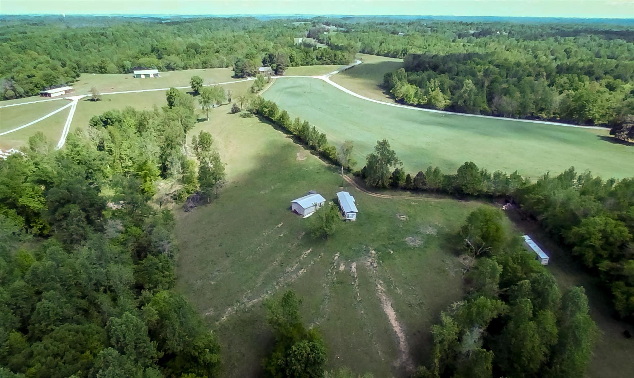 0 Tatum Road Pulaski, TN 38478 - Photo 24 of 30 an aerial view of residential houses with outdoor space and trees