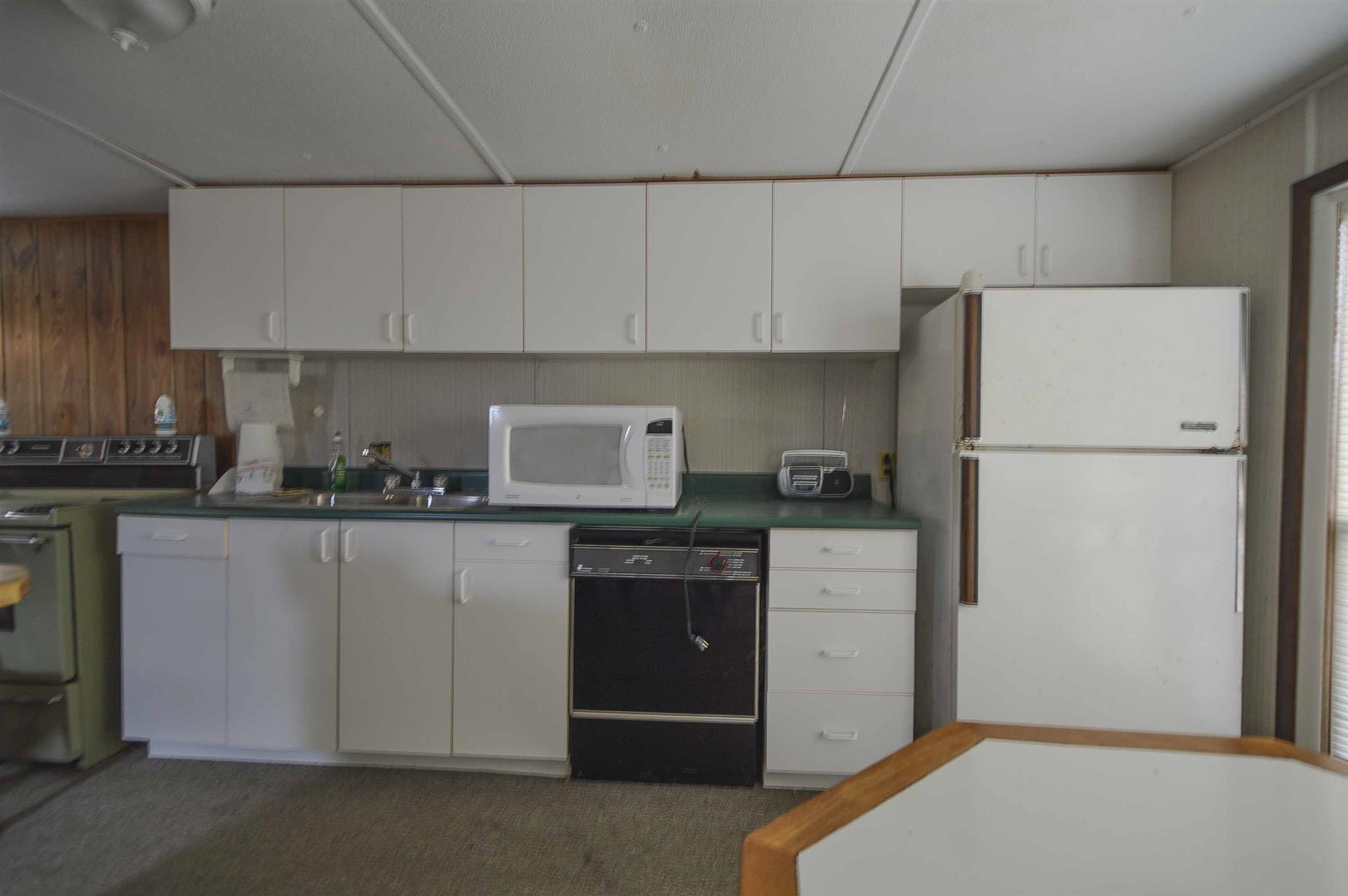 0 Tatum Road Pulaski, TN 38478 - Photo 28 of 30 a kitchen with a refrigerator sink stove and cabinets