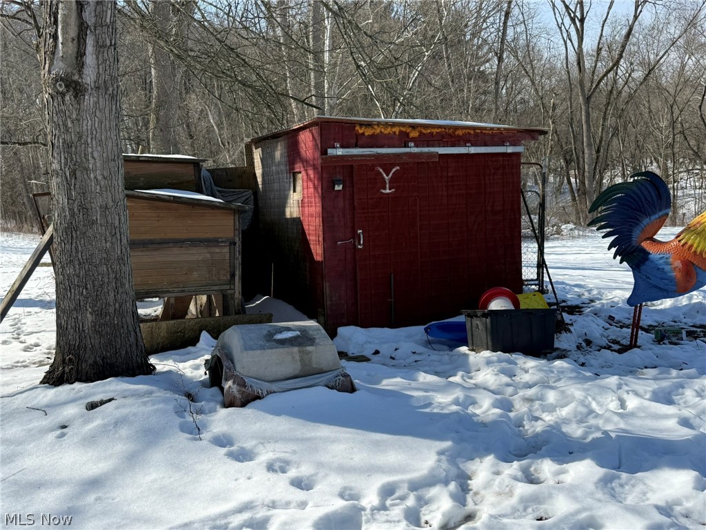 6784 Old Zoarville Road Northeast Dover, OH 44622 - Photo 44 of 50 Snow covered structure featuring a storage shed