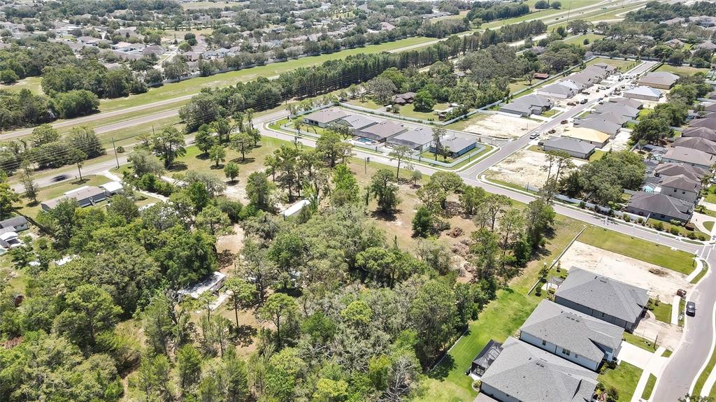 1087 Anderson Snow Road Spring Hill, FL 34609 - Photo 4 of 10 an aerial view of residential houses with outdoor space