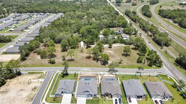 an aerial view of a house with a swimming pool