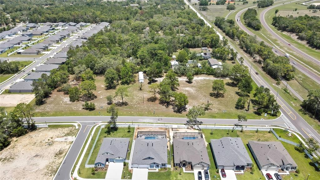 1087 Anderson Snow Road Spring Hill, FL 34609 - Photo 7 of 10 an aerial view of a house with a swimming pool