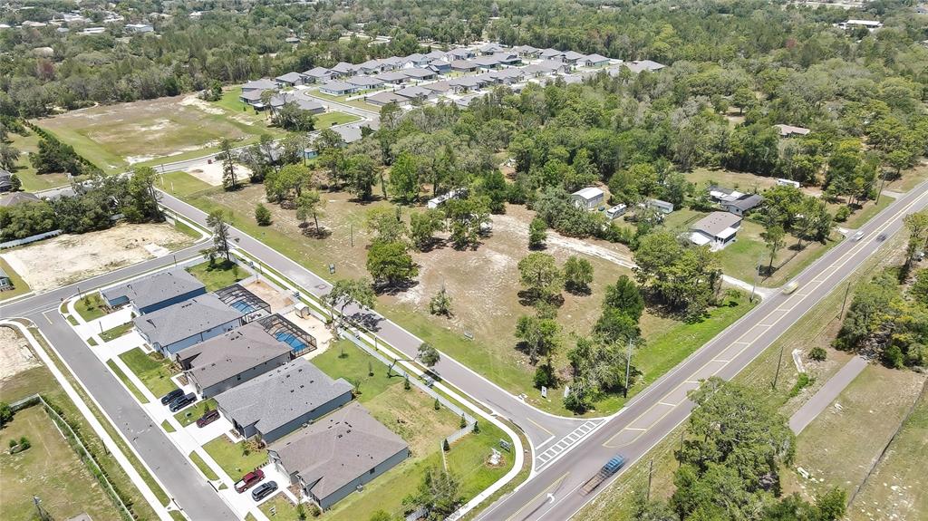 1087 Anderson Snow Road Spring Hill, FL 34609 - Photo 8 of 10 an aerial view of a residential houses with yard
