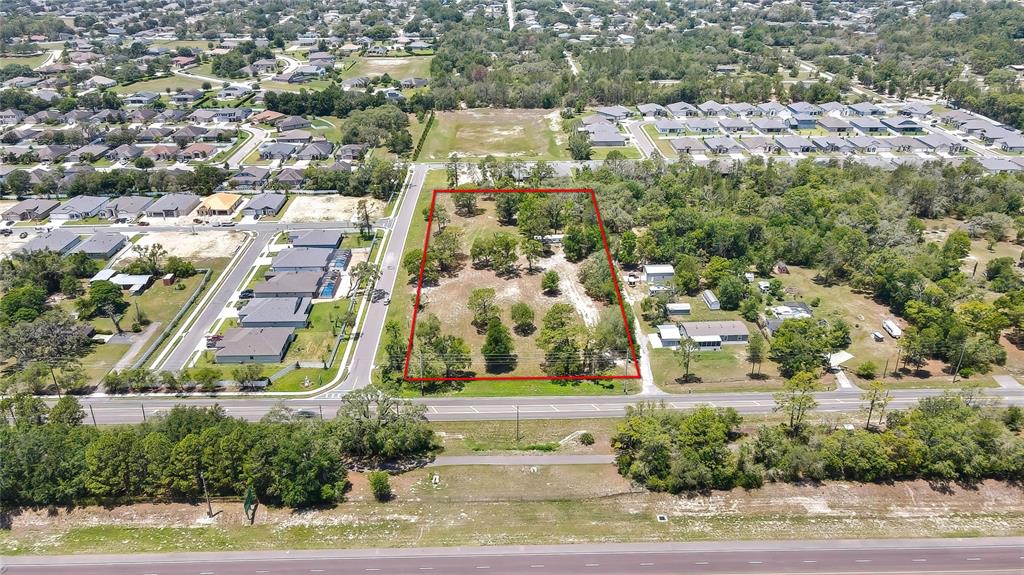 1087 Anderson Snow Road Spring Hill, FL 34609 - Photo 9 of 10 an aerial view of residential houses with yard