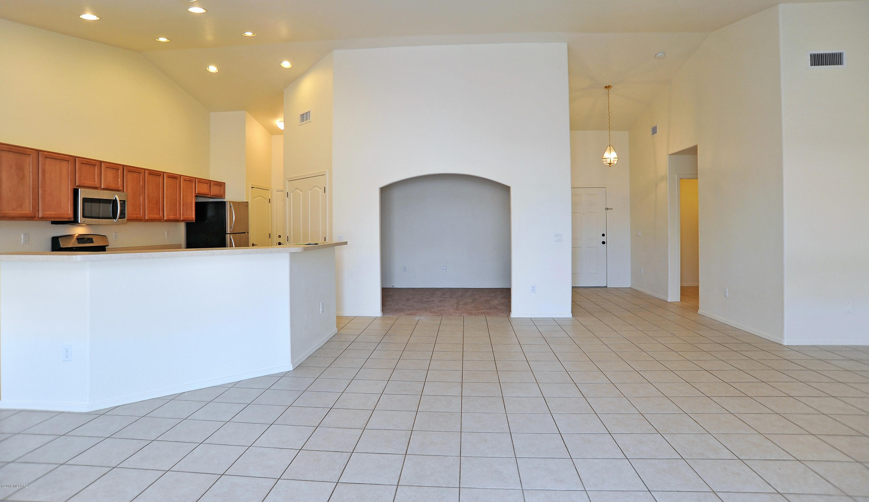 558 West Chatfield Street Vail, AZ 85641 - Photo 11 of 31 a view of a kitchen with a sink and a microwave