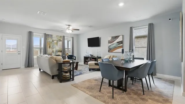 a kitchen with stainless steel appliances kitchen island a sink stove and refrigerator