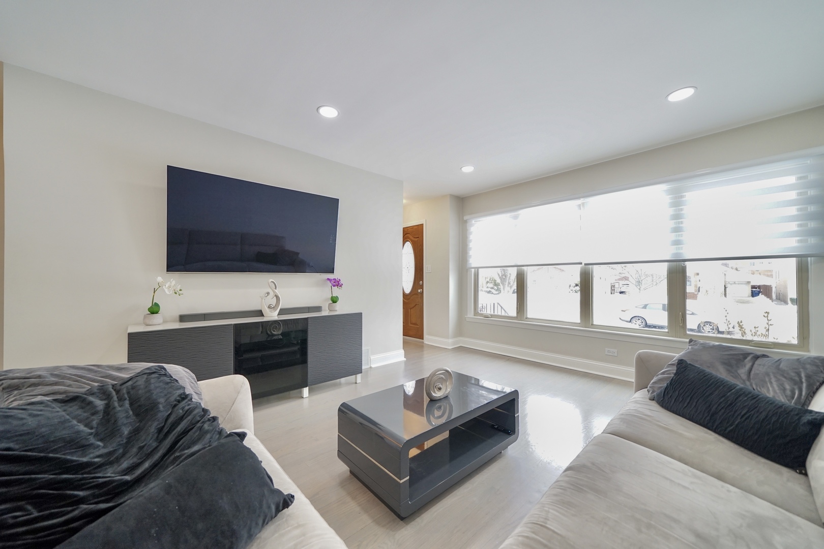 7122 Agatite Avenue Norridge, IL 60706 - Photo 11 of 64 a living room with furniture and a flat screen tv