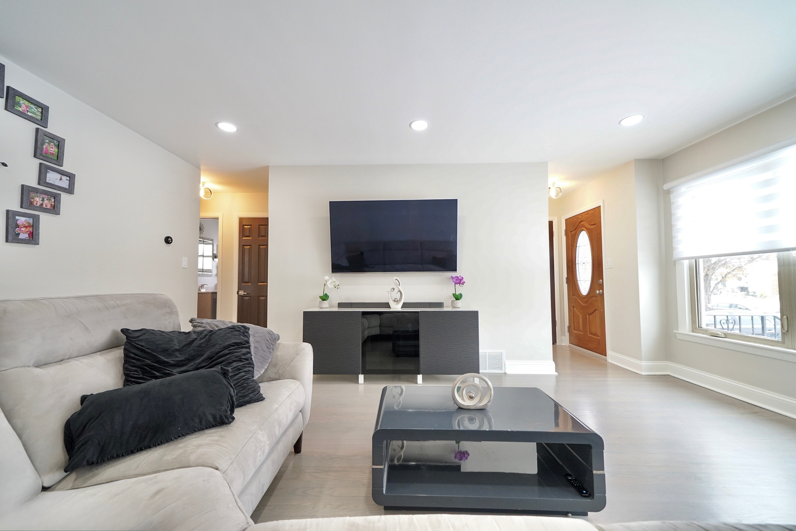 7122 Agatite Avenue Norridge, IL 60706 - Photo 2 of 64 a living room with furniture and a flat screen tv