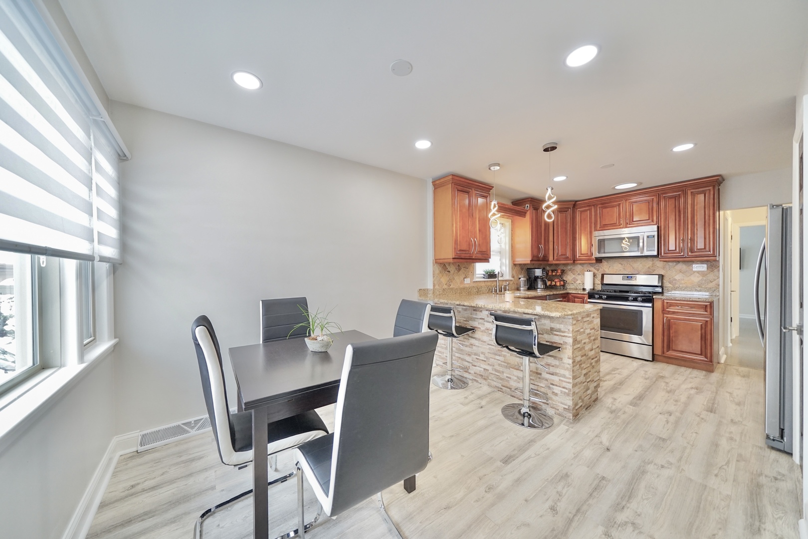 7122 Agatite Avenue Norridge, IL 60706 - Photo 24 of 64 a view of a dining room with furniture