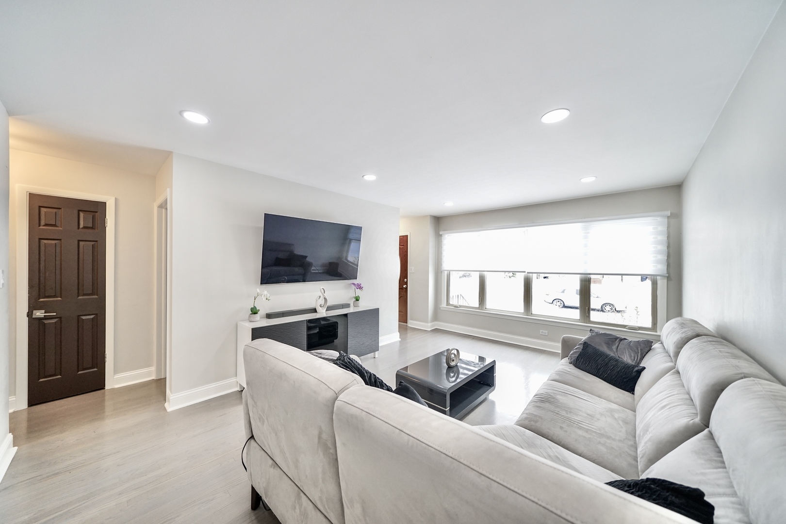 7122 Agatite Avenue Norridge, IL 60706 - Photo 3 of 64 a living room with furniture and a flat screen tv