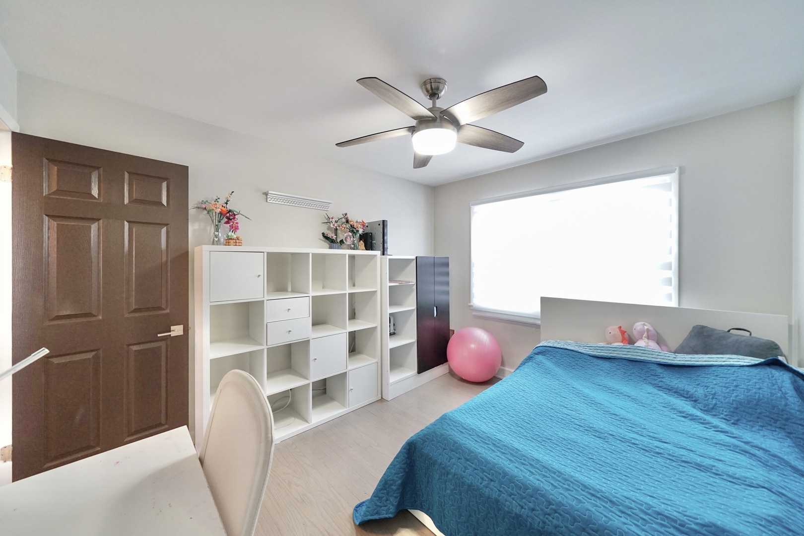 7122 Agatite Avenue Norridge, IL 60706 - Photo 35 of 64 a bedroom with a bed closet and wooden floor