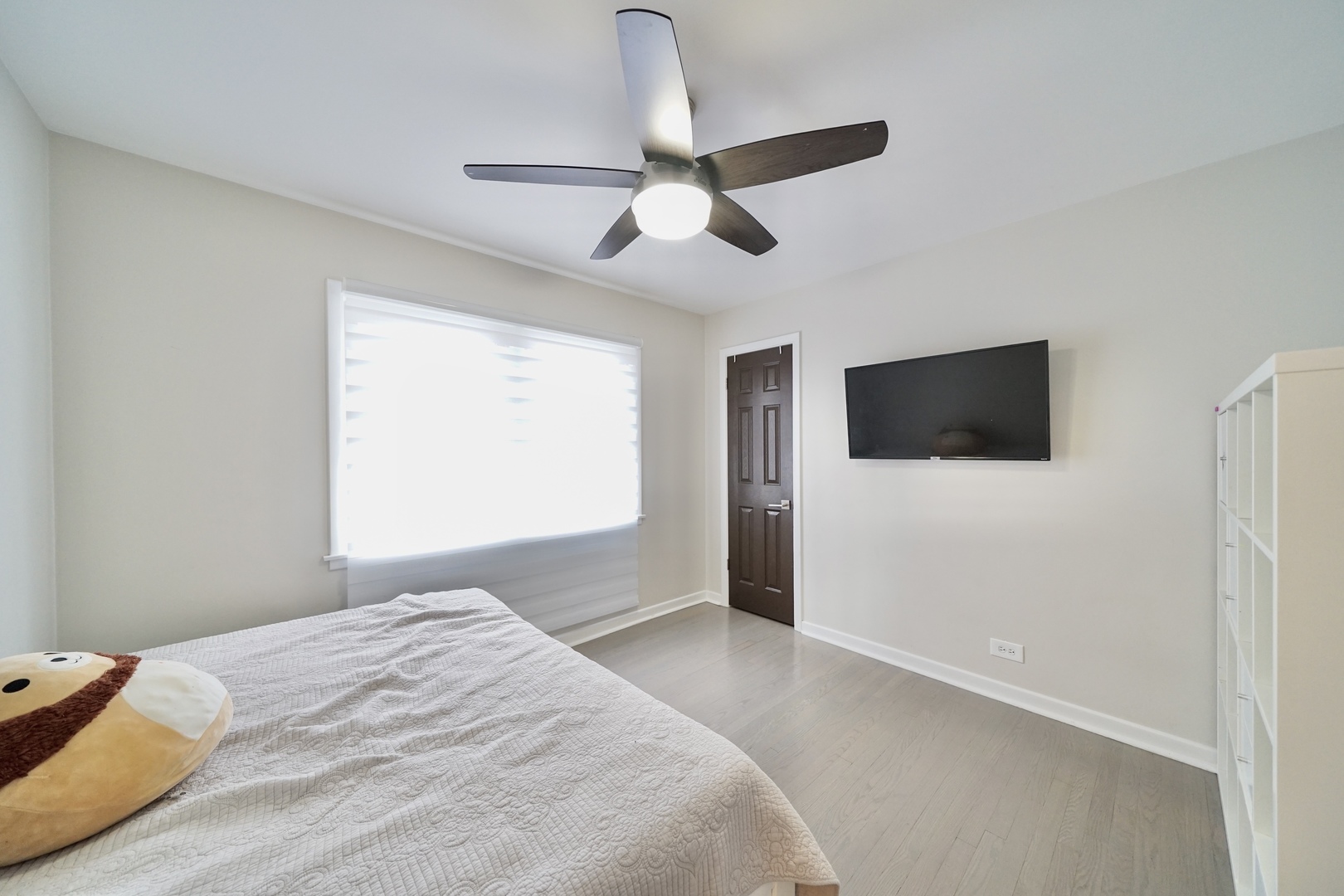 7122 Agatite Avenue Norridge, IL 60706 - Photo 39 of 64 a bedroom with a bed and a flat screen tv