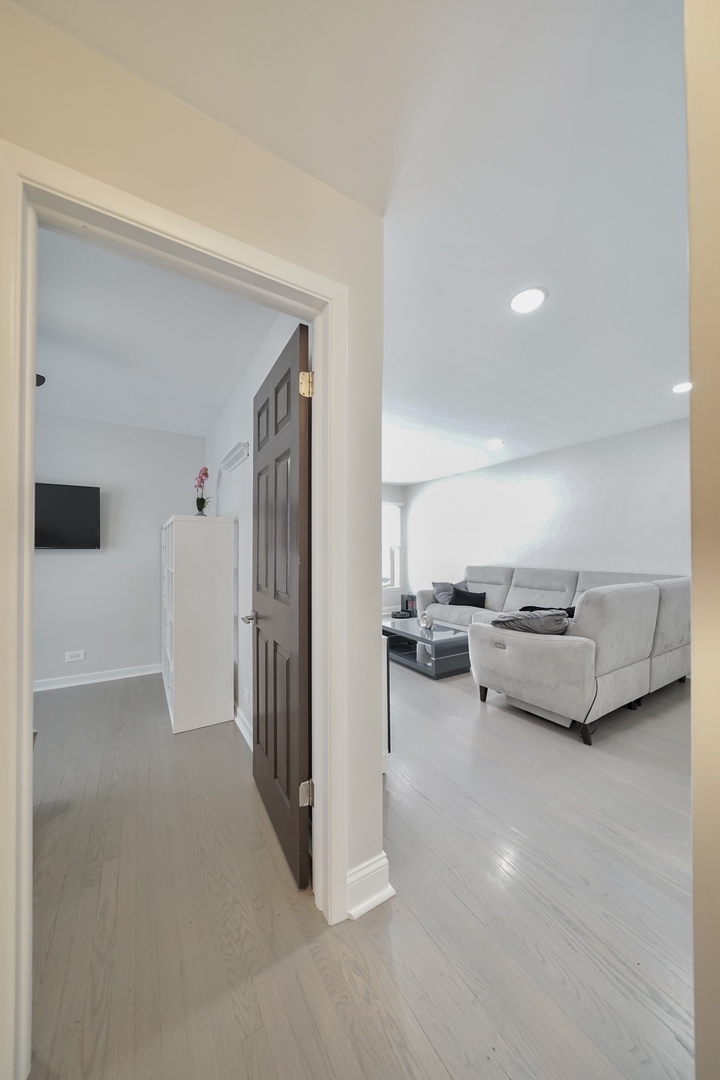 7122 Agatite Avenue Norridge, IL 60706 - Photo 47 of 64 a living room with furniture and a flat screen tv