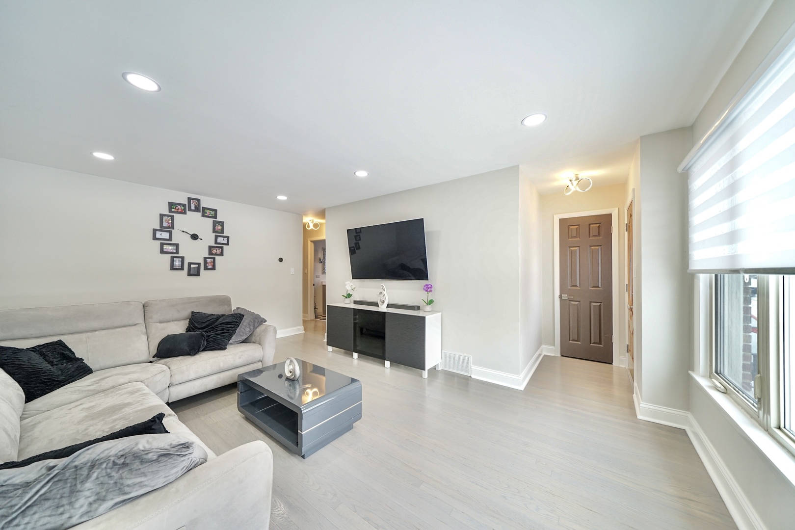 7122 Agatite Avenue Norridge, IL 60706 - Photo 5 of 64 a living room with furniture and a flat screen tv