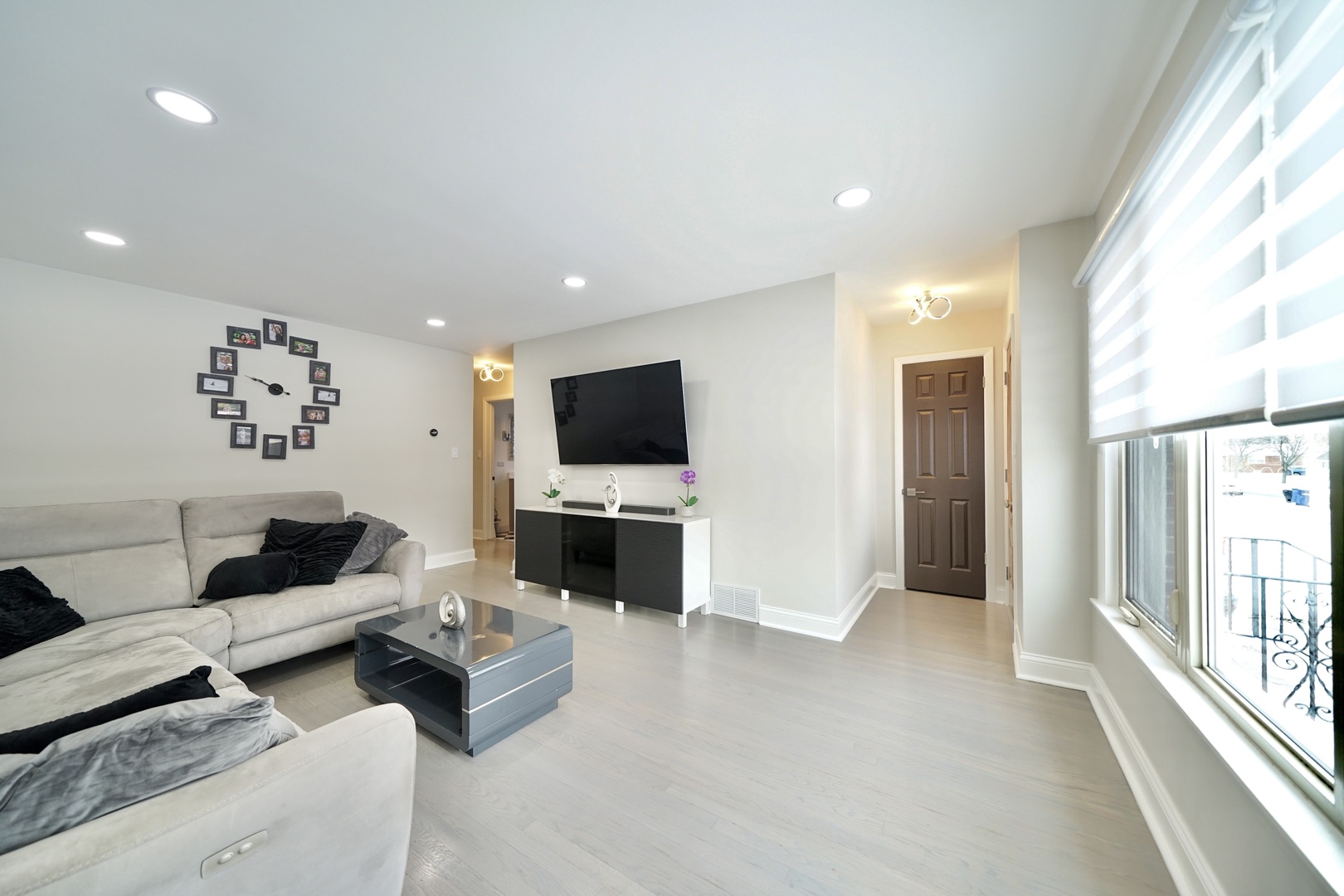 7122 Agatite Avenue Norridge, IL 60706 - Photo 9 of 64 a living room with furniture and a flat screen tv