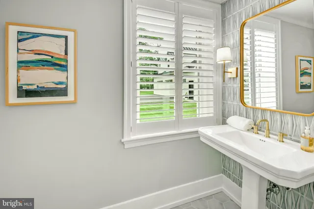 a utility room with sink dryer and washer