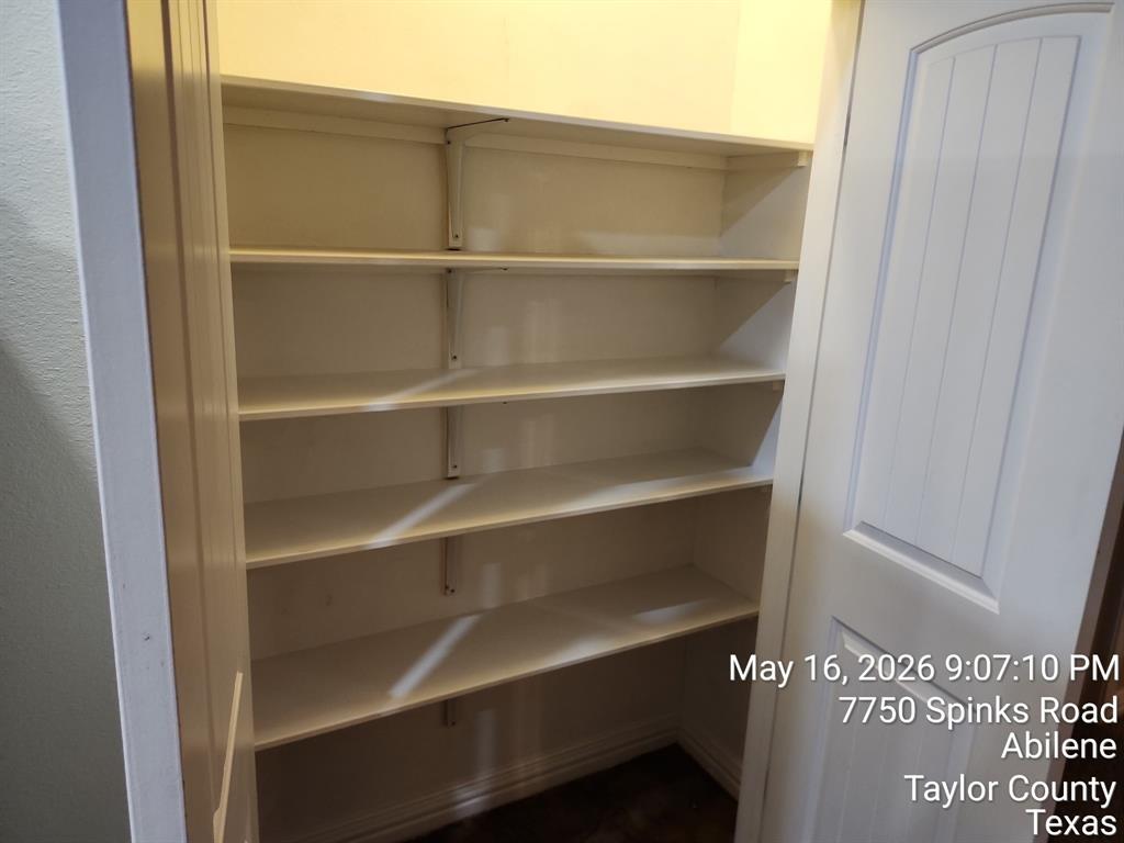 7750 Spinks Road Abilene, TX 79603 - Photo 14 of 15 a view of walk in closet with empty racks