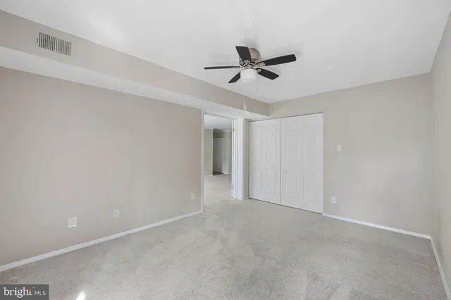 a bathroom with a sink toilet vanity and shower