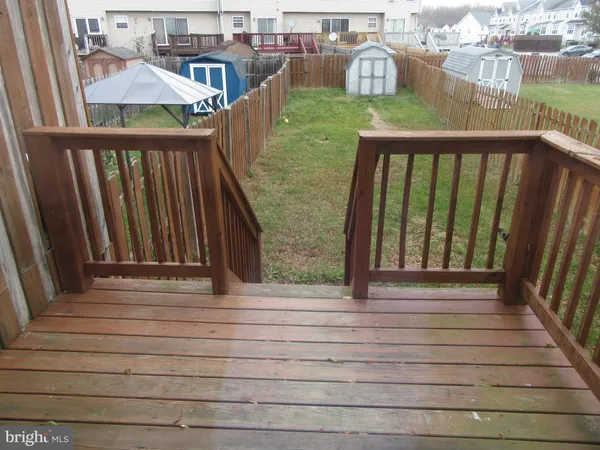 a view of a balcony with wooden floor