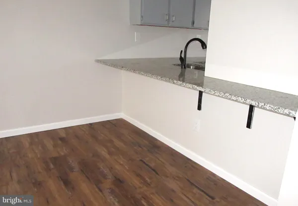 a close view of a sink and dishwasher in a kitchen