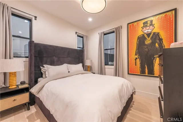 a bedroom with a large bed and a window