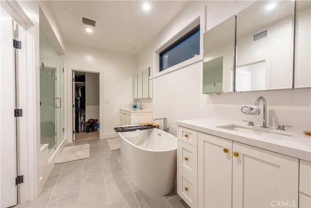 a spacious bathroom with a sink double vanity